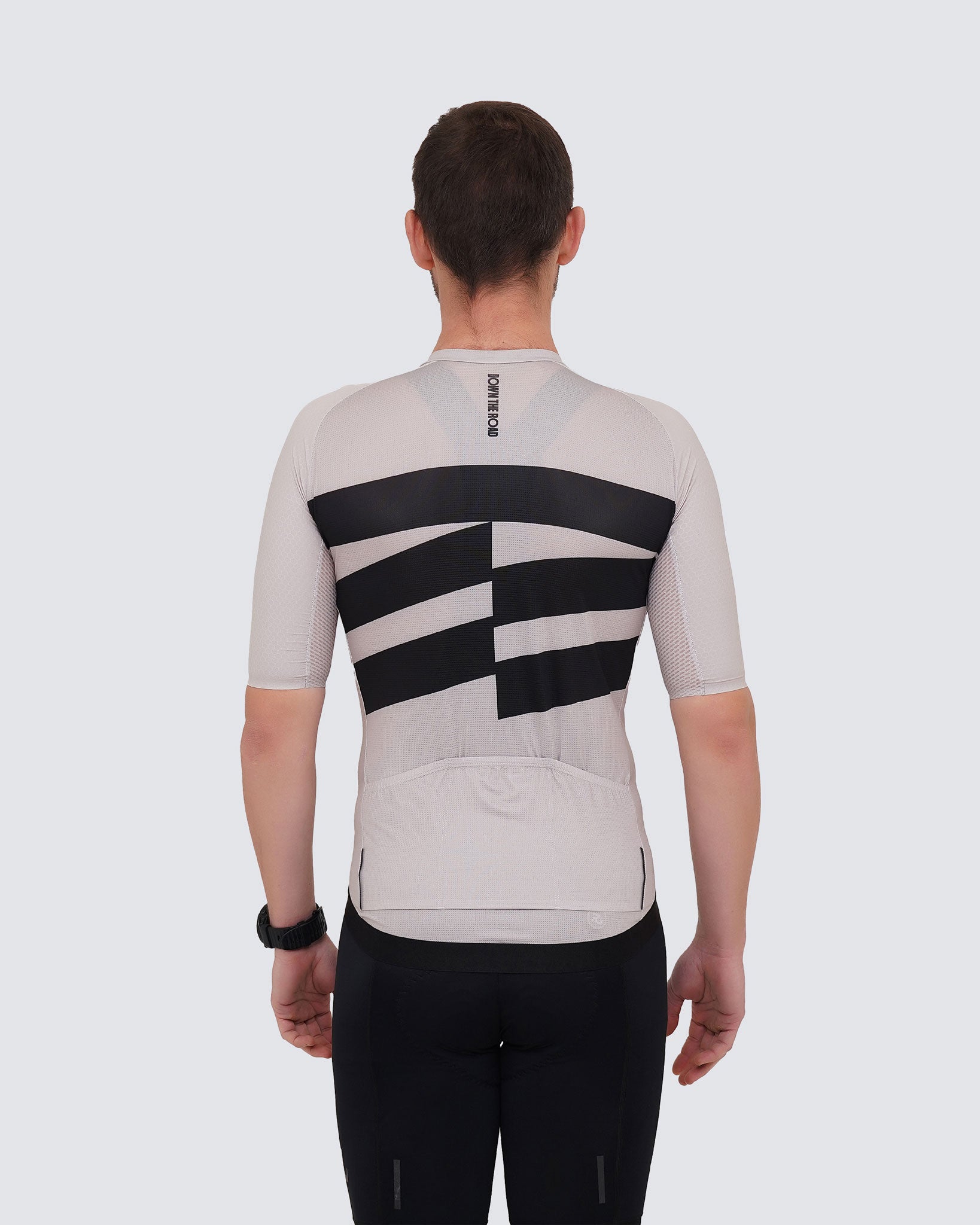 back view of man breakaway cycling jersey beige