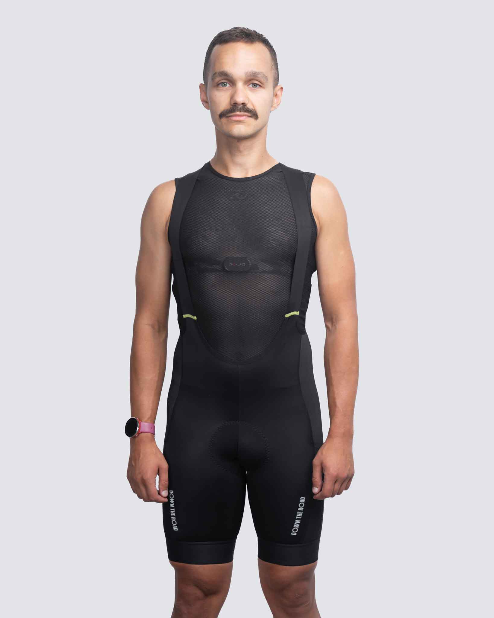 Man wearing black cargo bibs