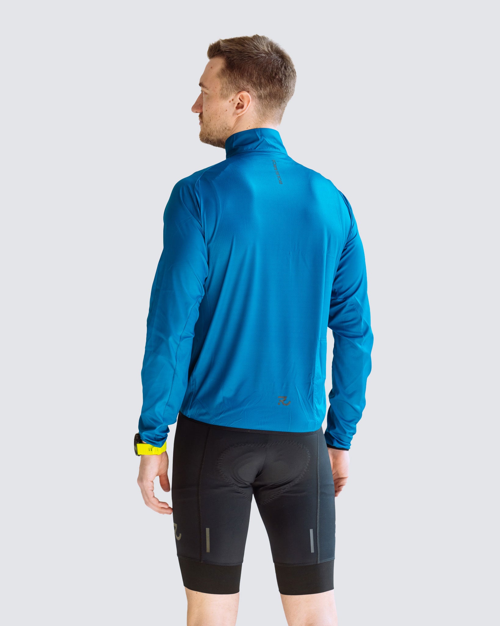 Navy Blue men windbreaker back view model looking to the side