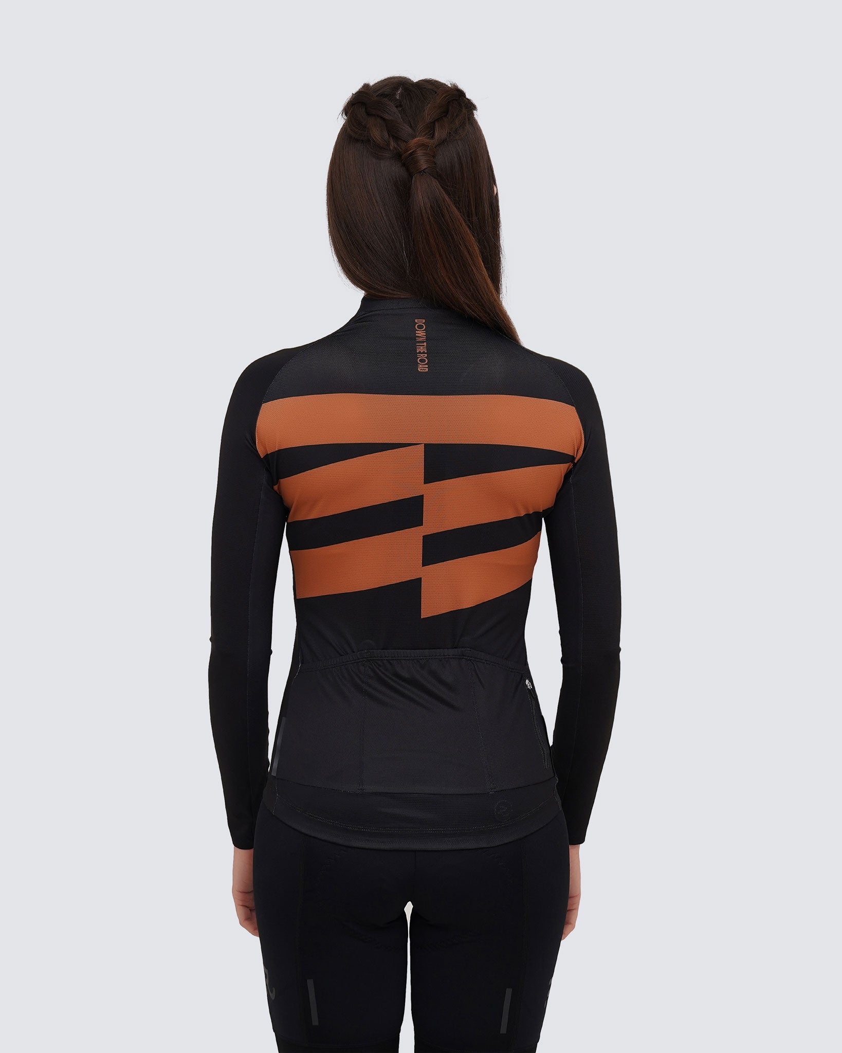 back view of black long sleeve cycling jersey for women