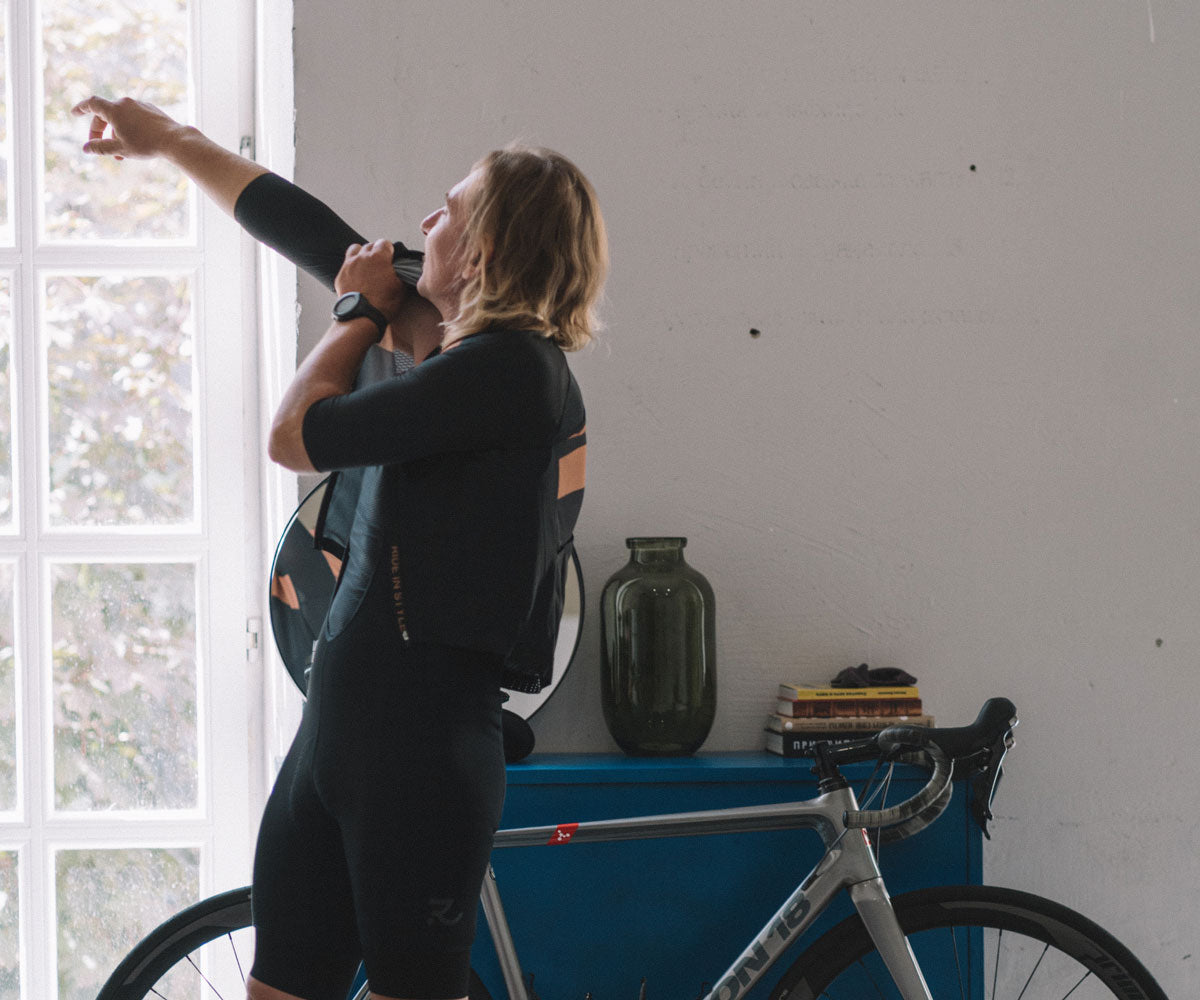 man with dark cycling kit