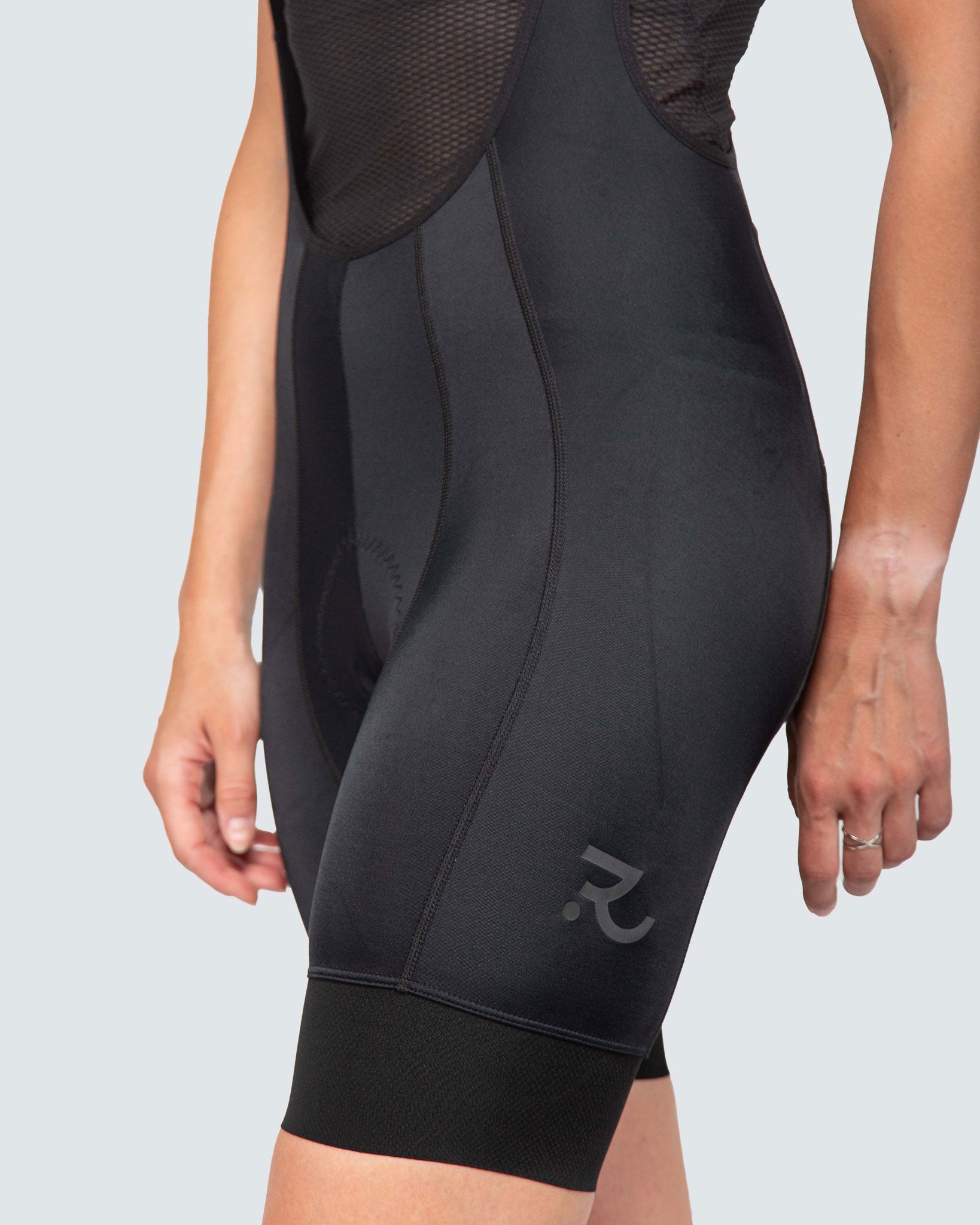 close up to black bibs and reflective detail