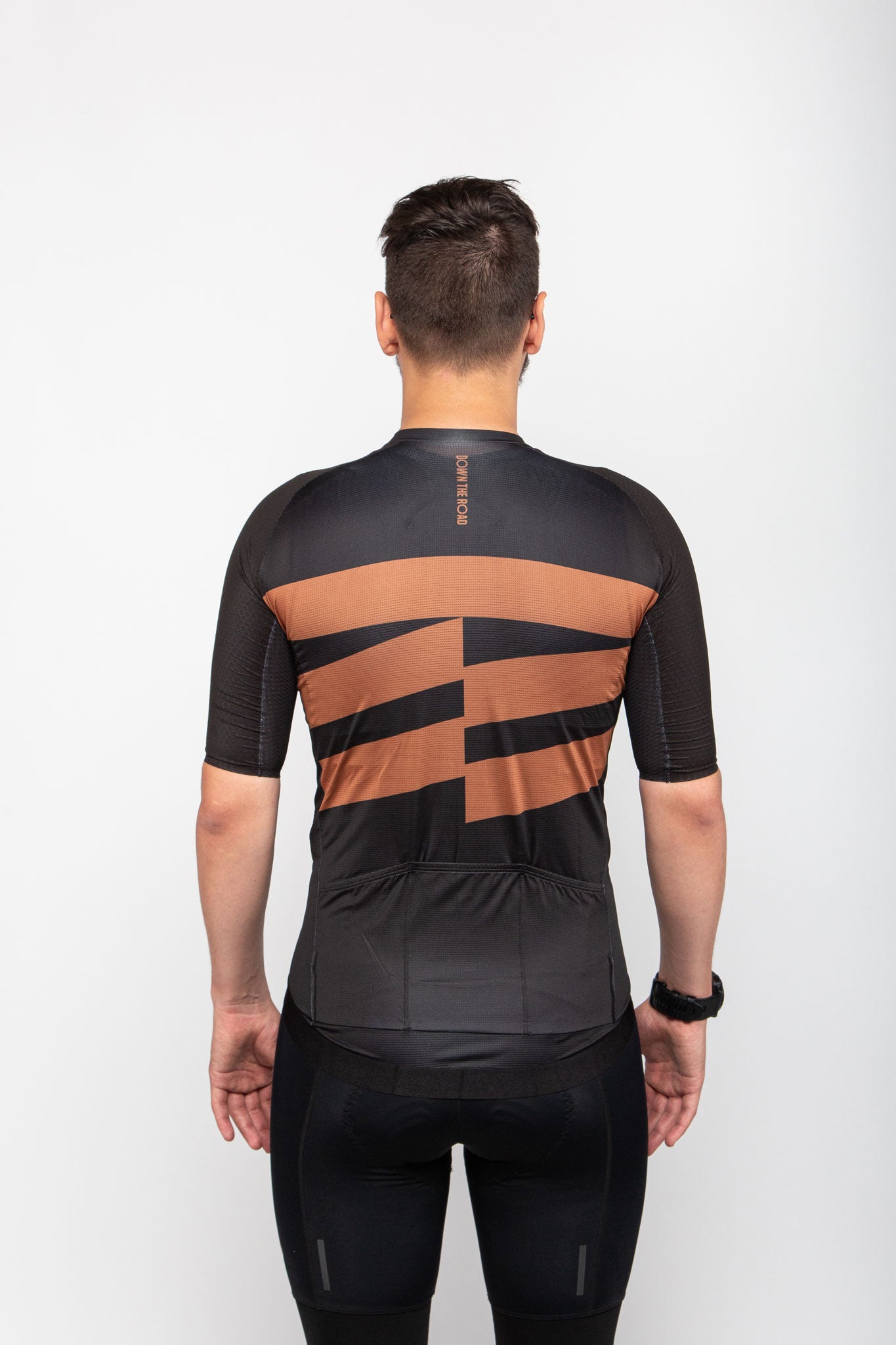 man wearing black cycling breakway jersey