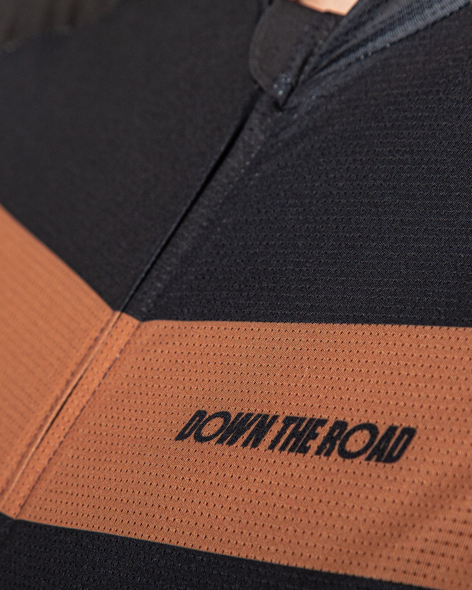 close up to zipper and chest fo black cycling jersey