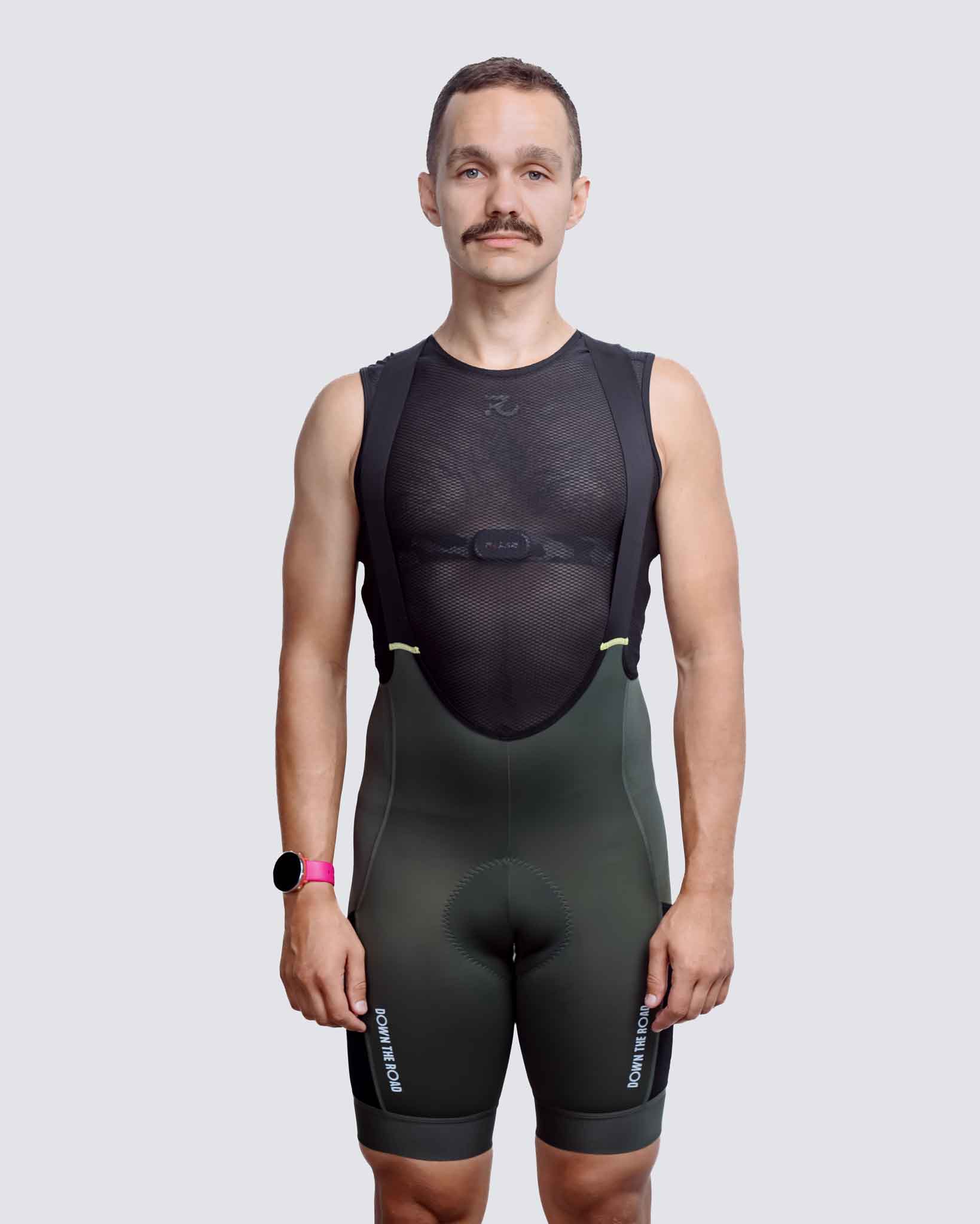 man wearing green cargo bibs for cycling