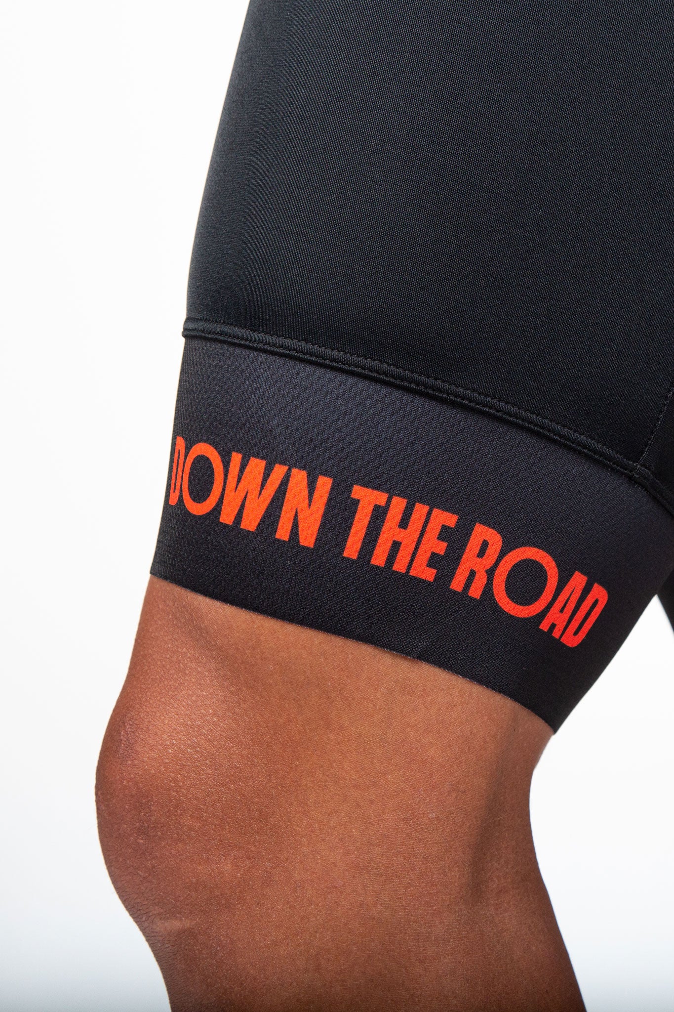 close up to leg powerband of breakaway trisuit orange men