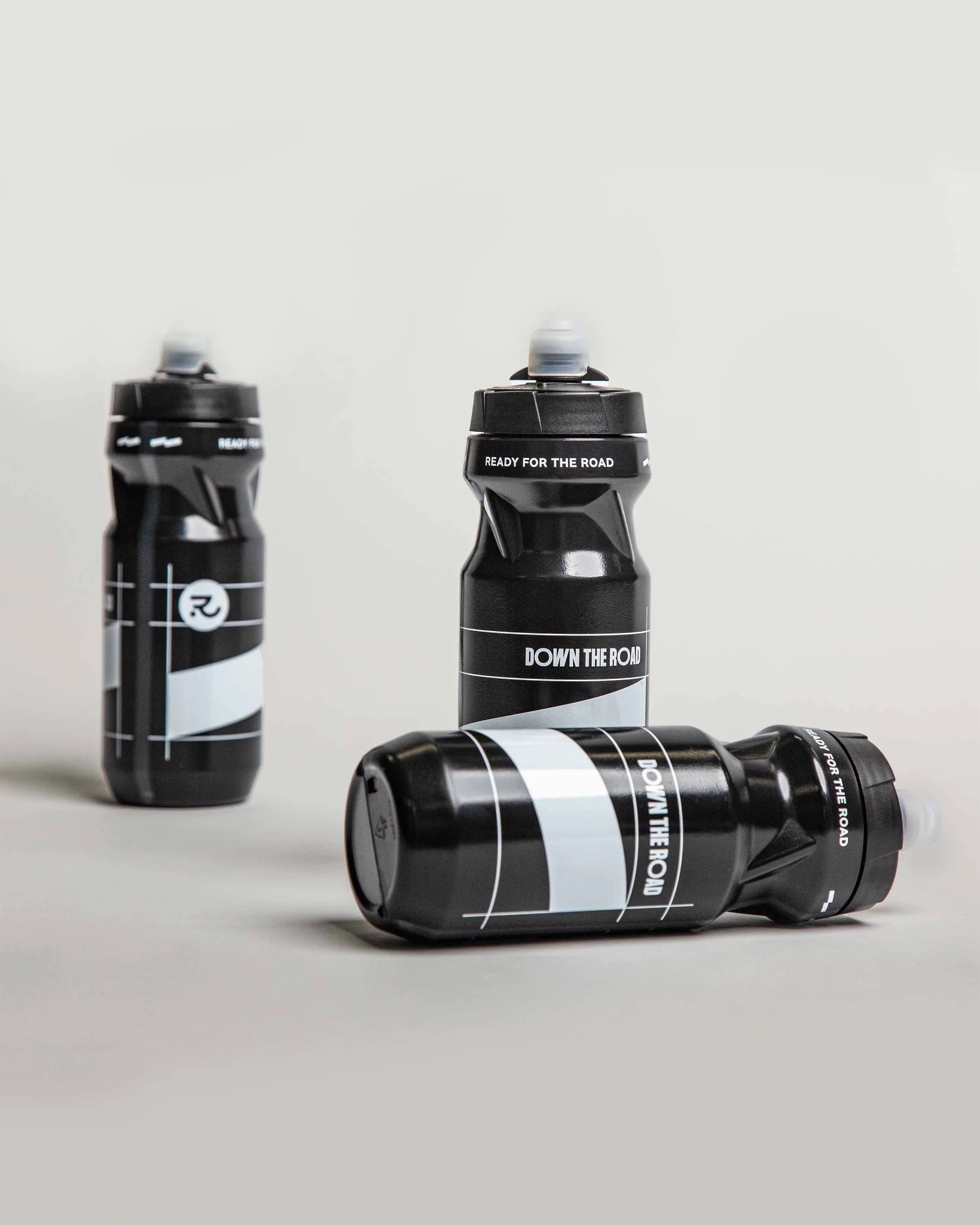 three black cycling bottles of 610 ml