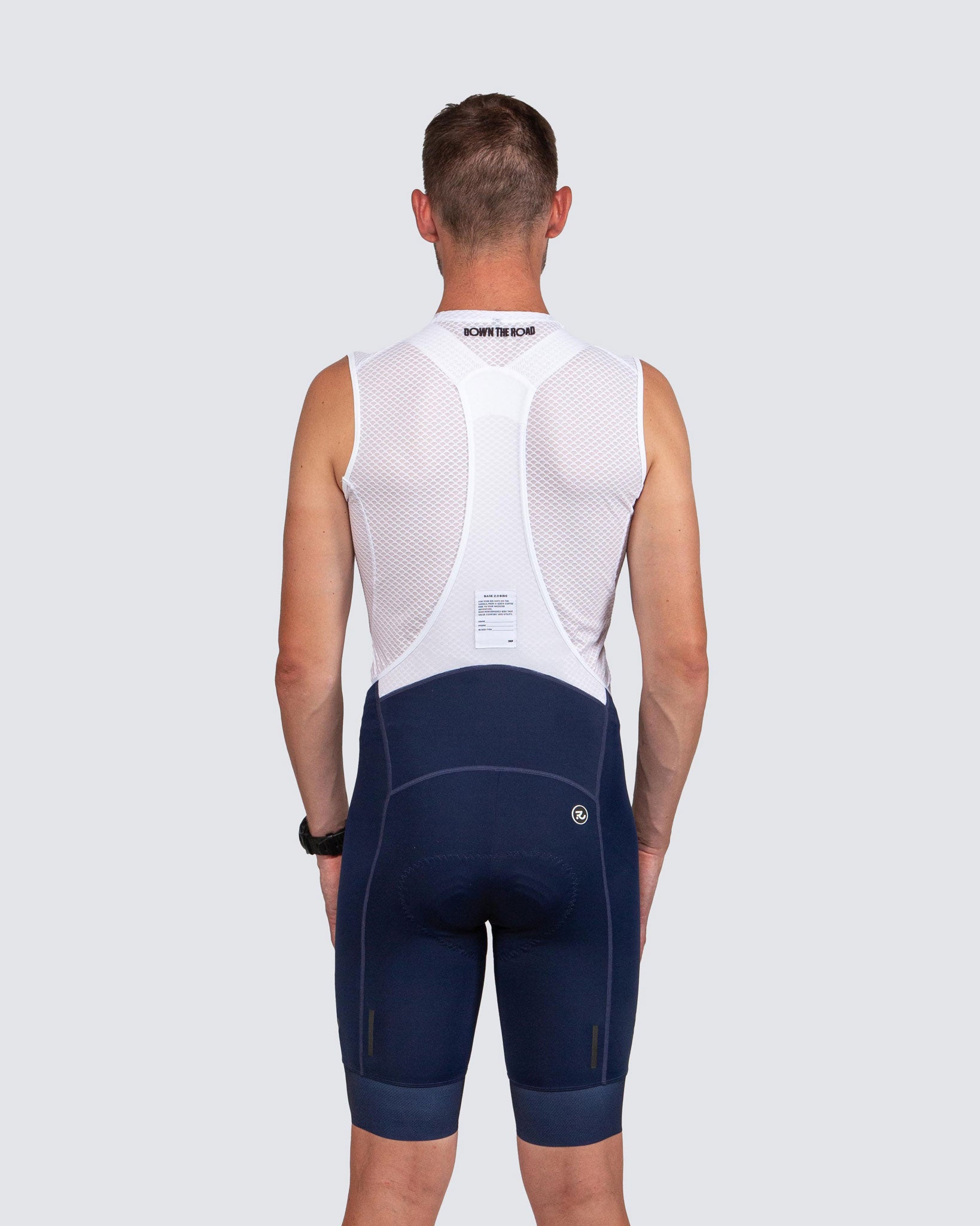 back of man wearing blue bibs