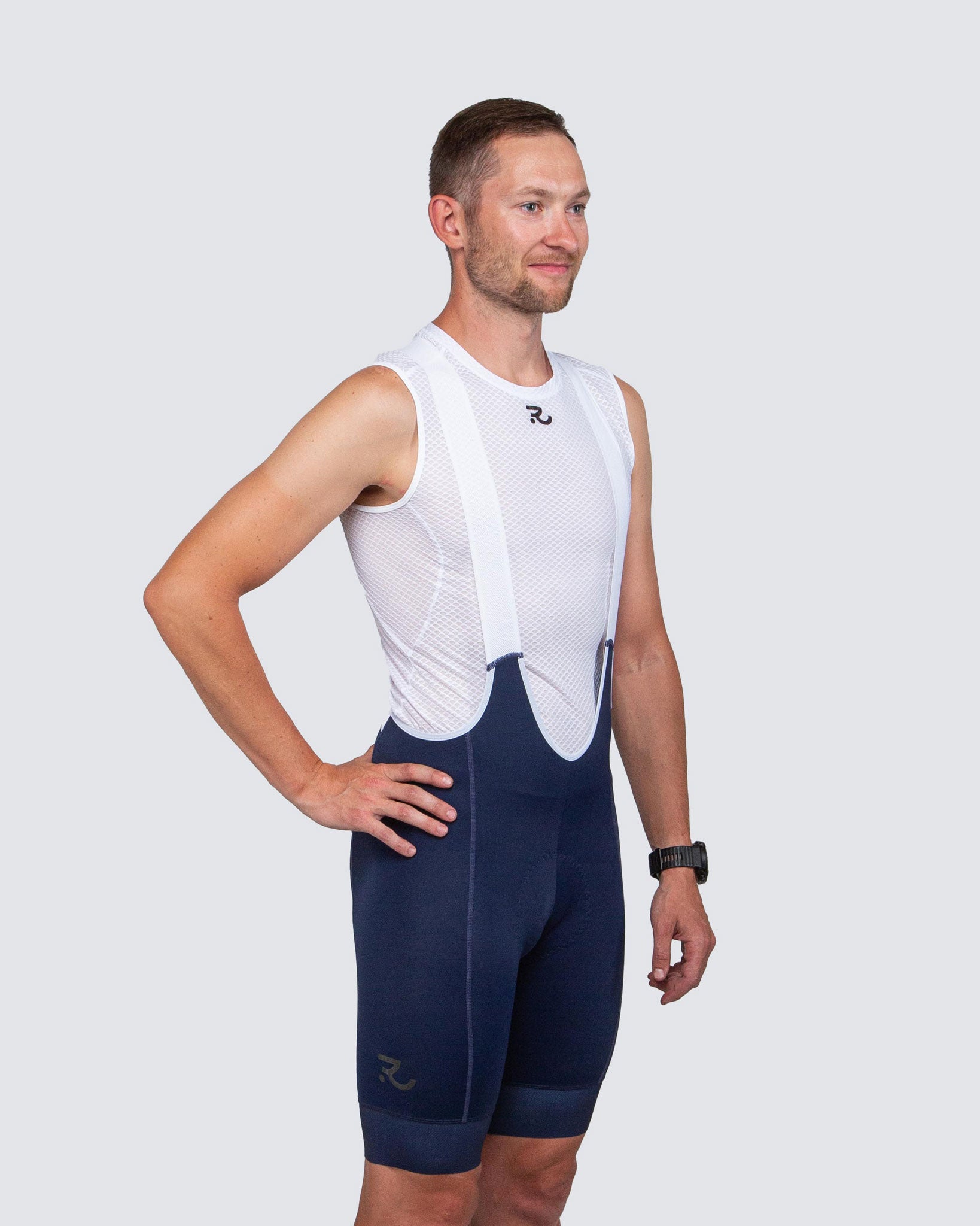 standing man wearing blue bibs