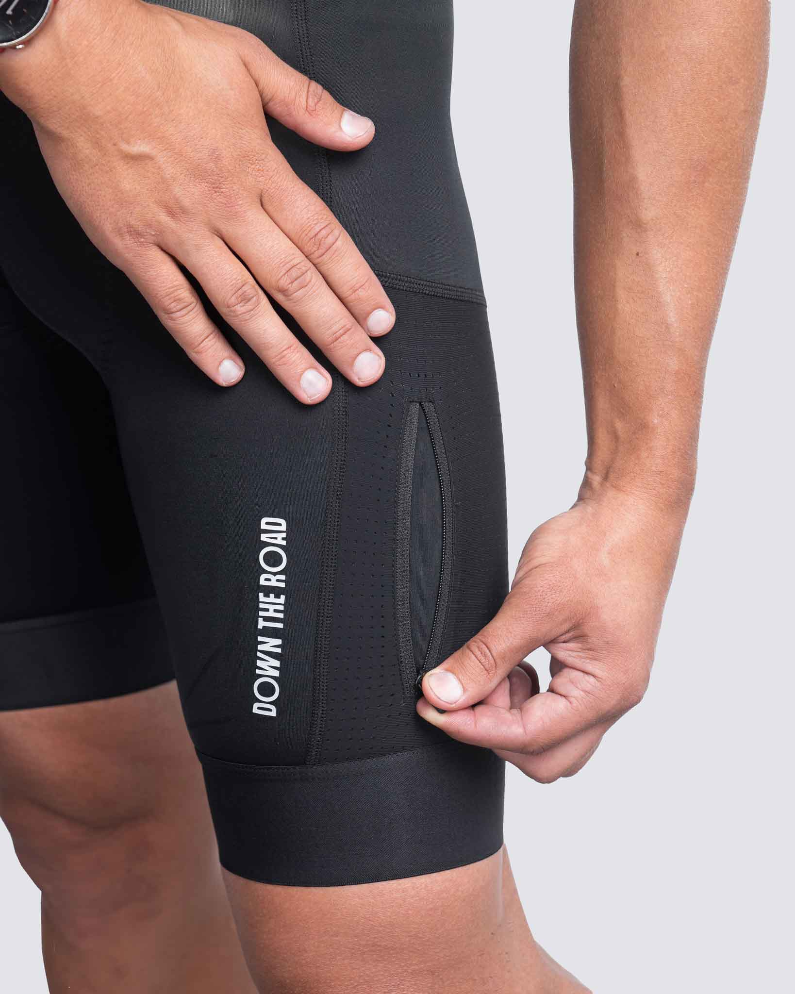 close up of zipper pocket on cargo bibs
