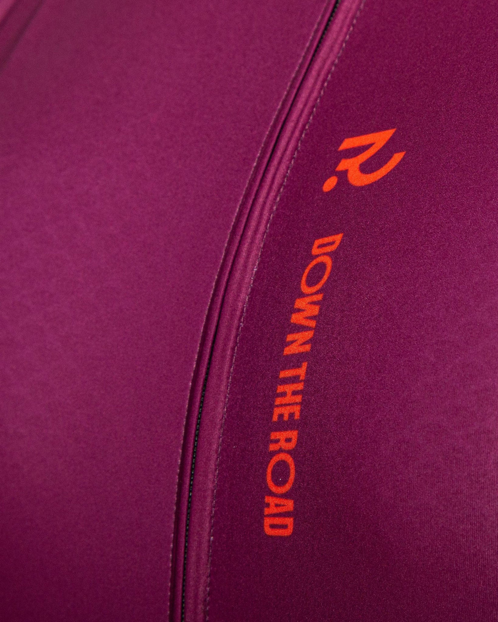 close up of plum and orange cycling jersey
