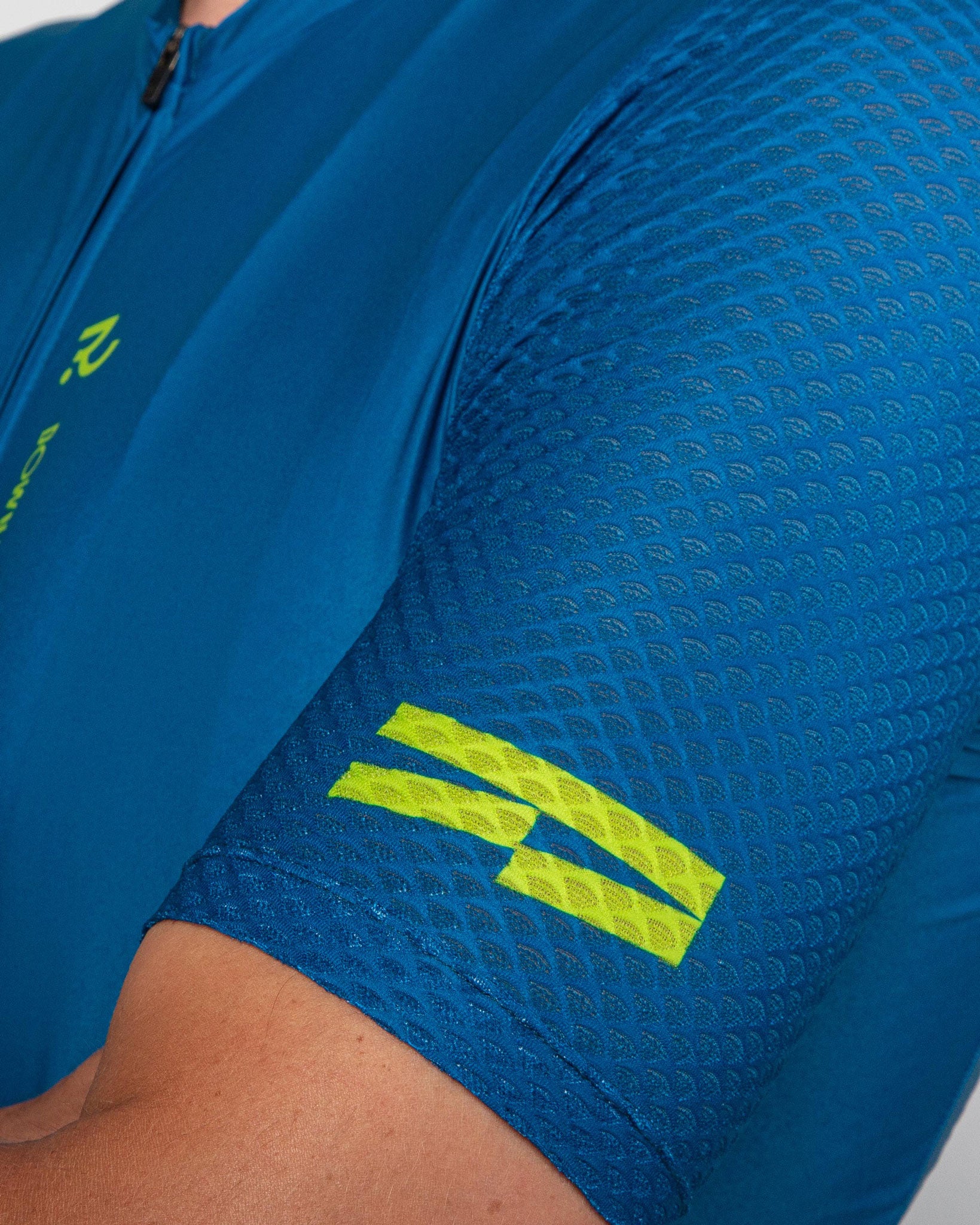 sleeve close up of Men's Century Jersey Teal and Green