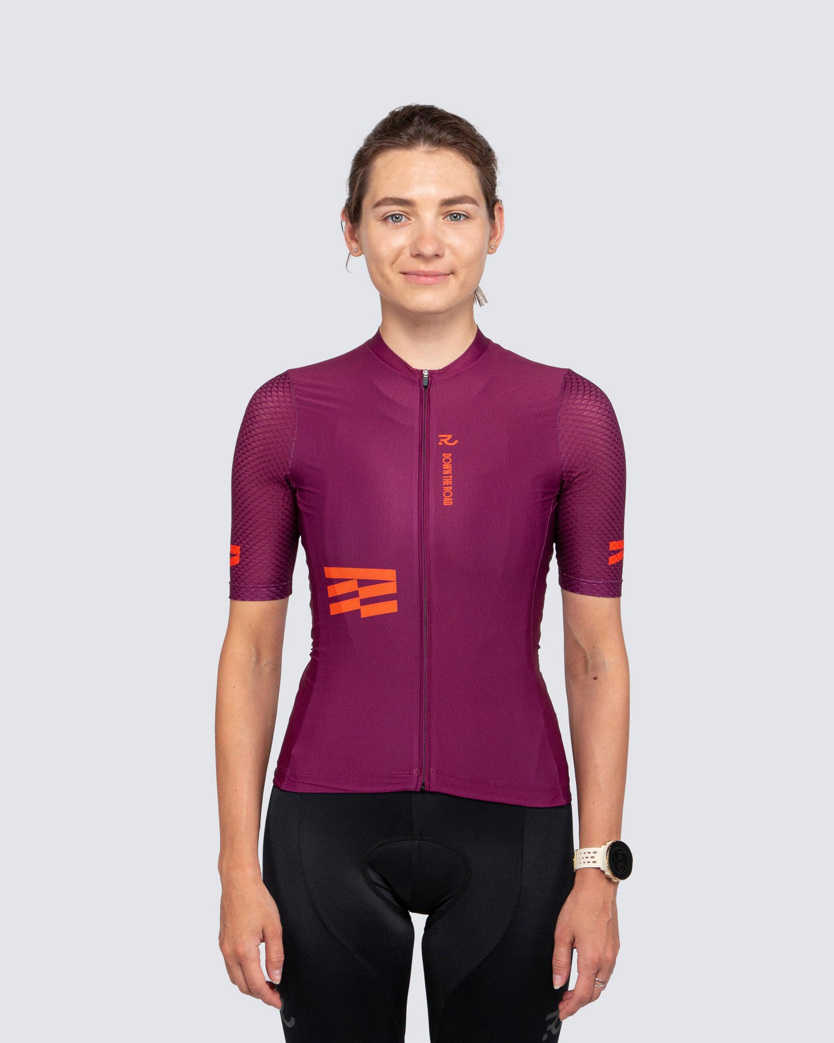 woman wearing Plum & Orange century cycling jersey