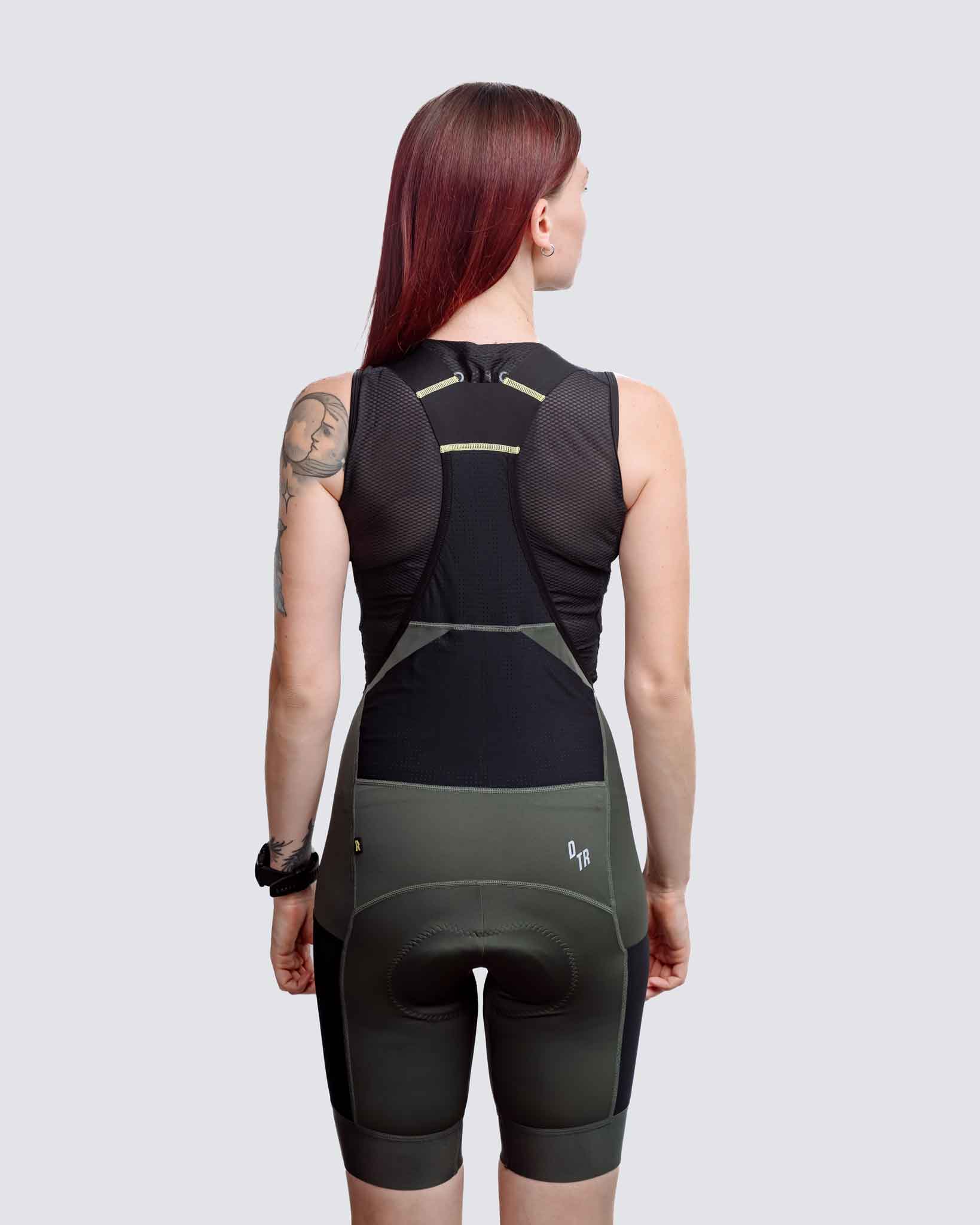 green cargo bibs for women with pockets and a zipper pocket