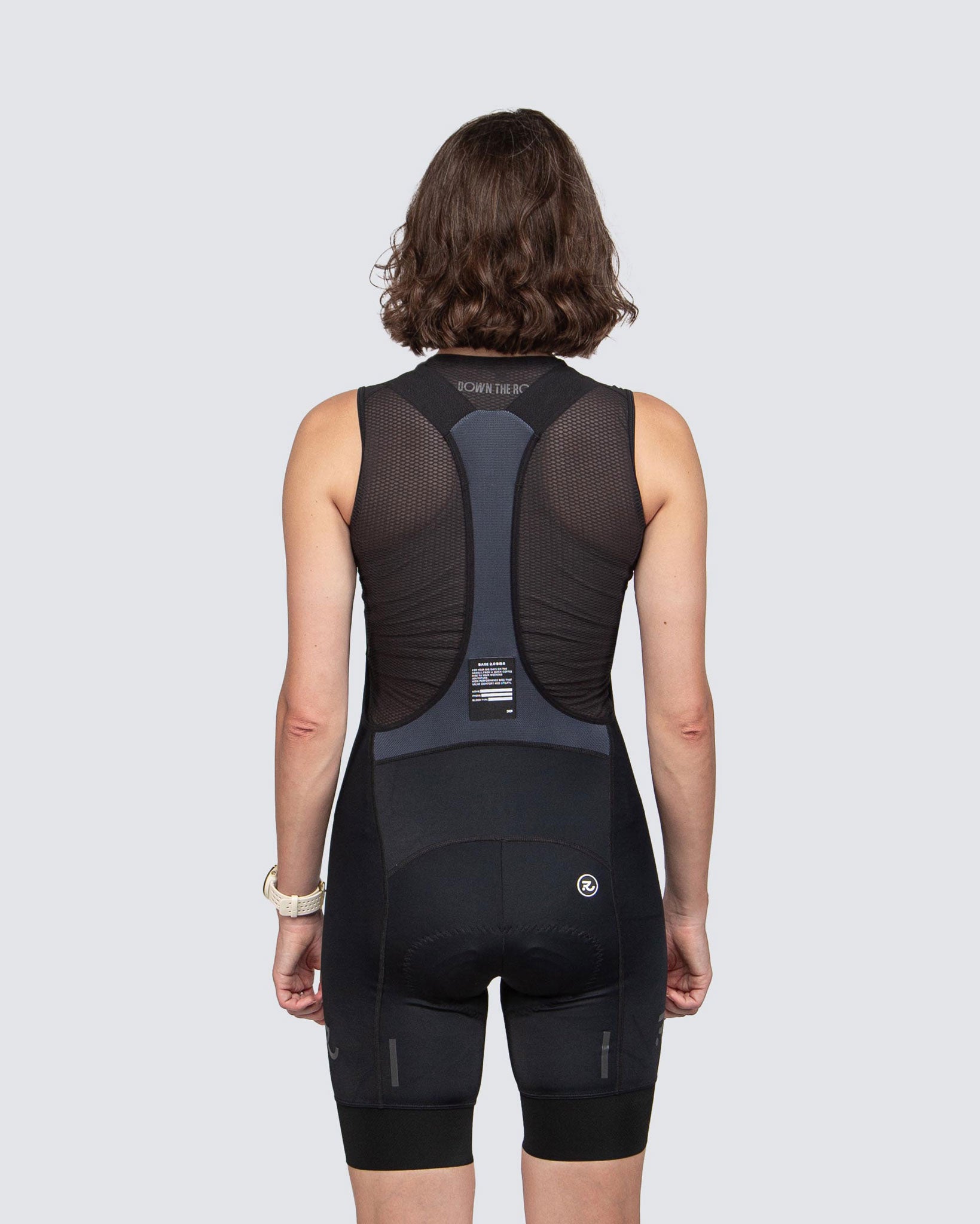 back view fo black cycling bibs and black base layer