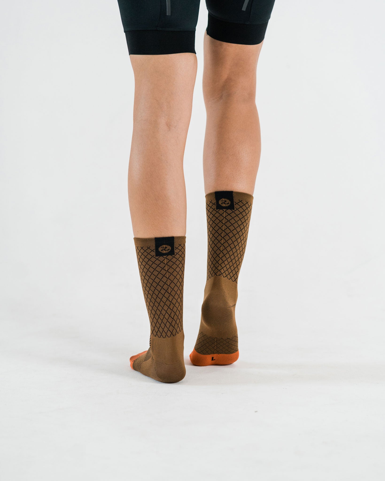 back side of brown cycling socks with details