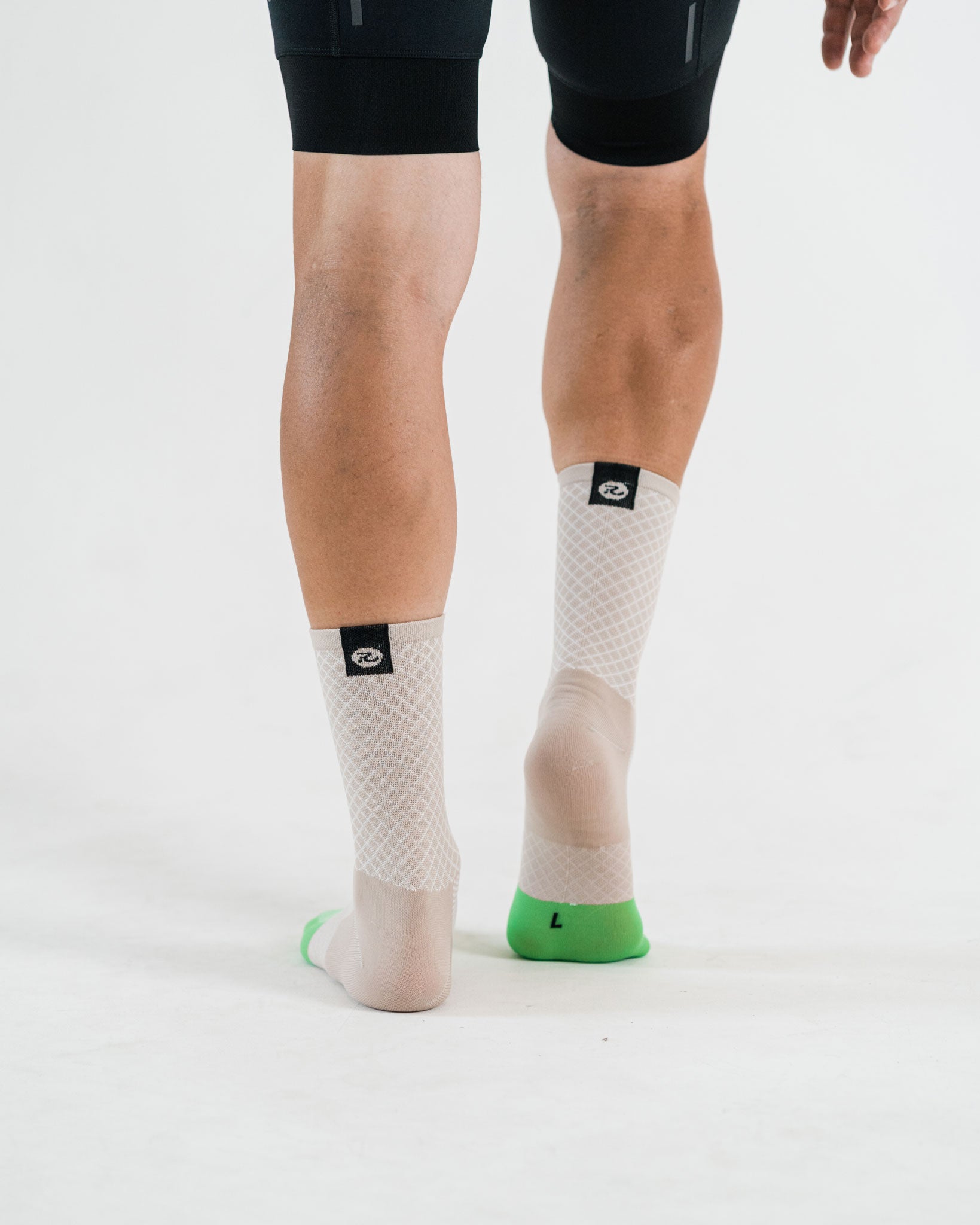 beige socks with black down the road logo