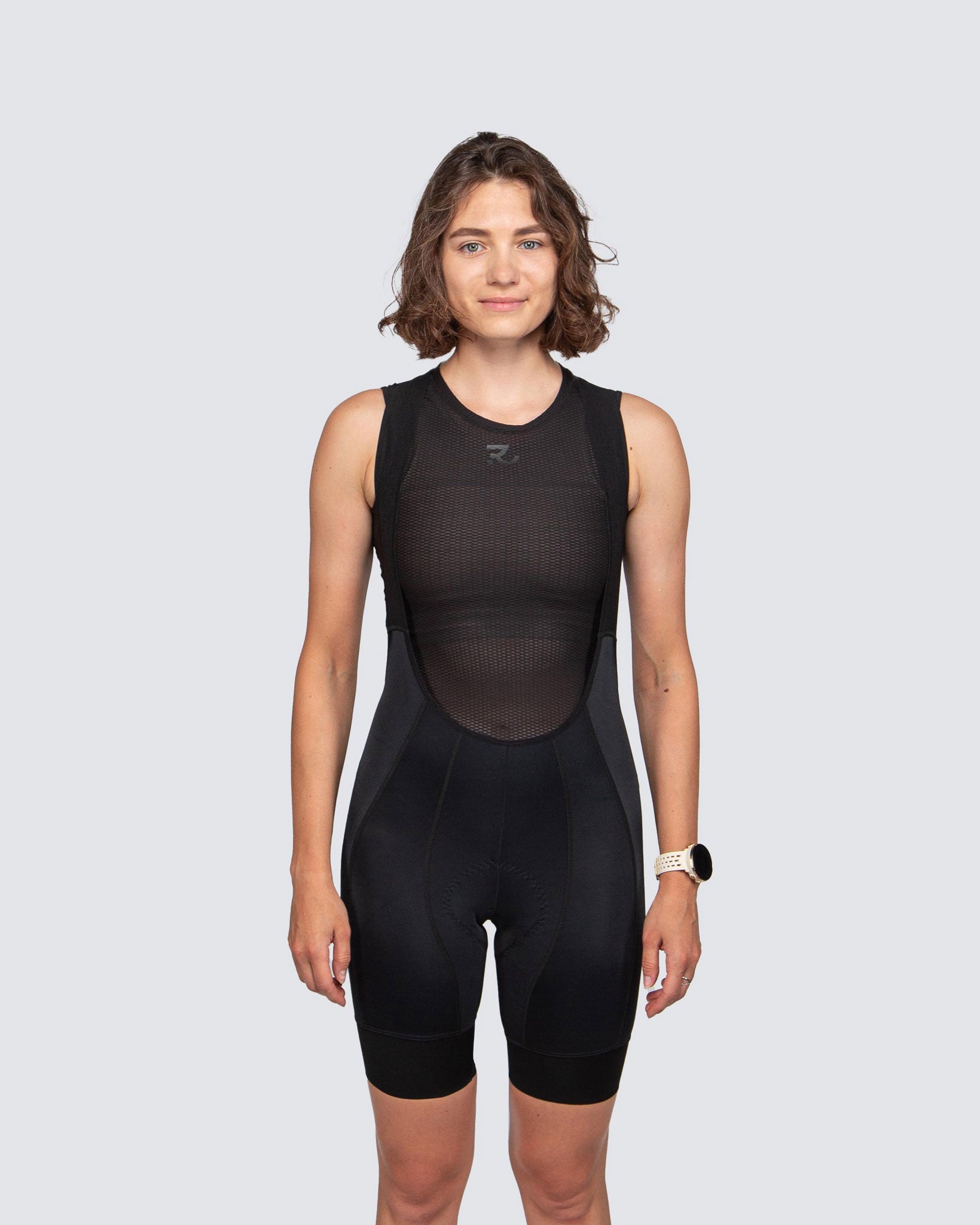front view of black cycling bib shorts with black base layer