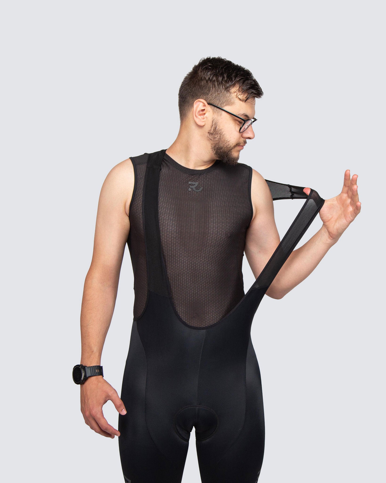 man with black cycling bibs and base layer