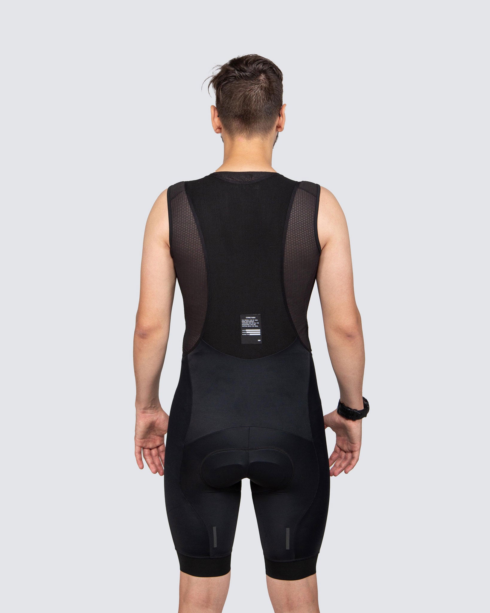 back of black bib shorts for men