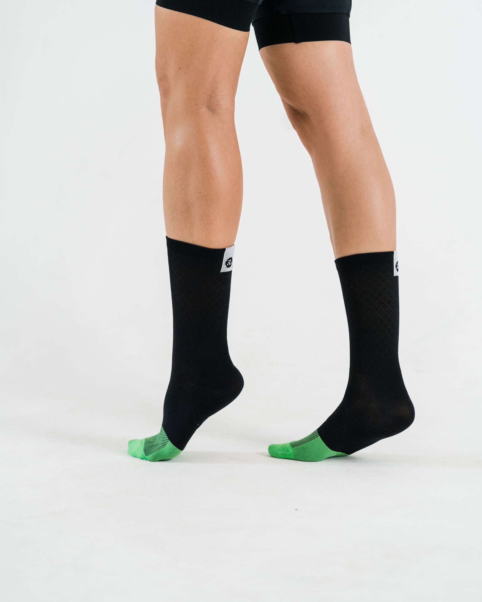 woman wearing black cycling socks