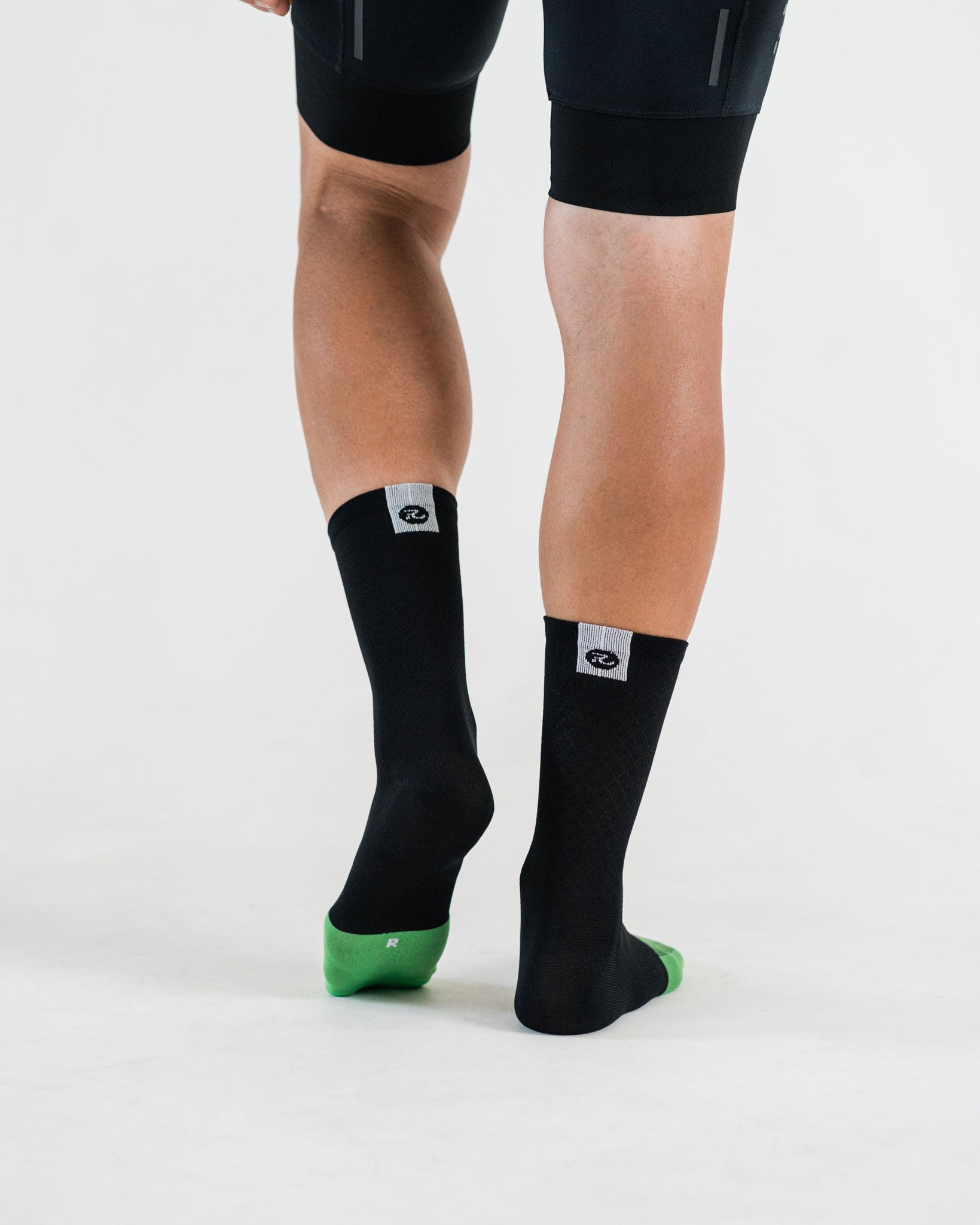 back view of black cycling socks