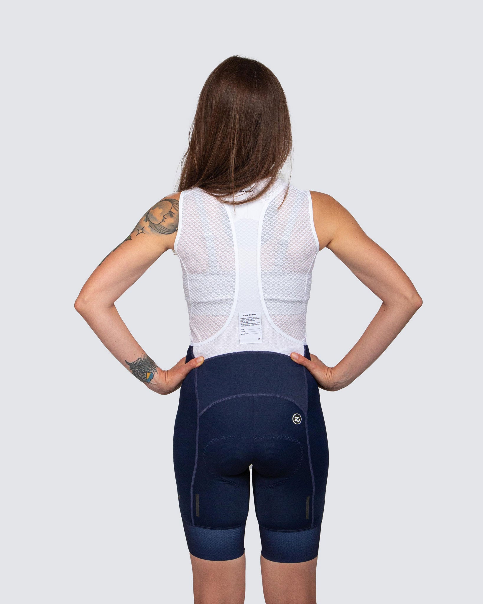 back view of blue cycling bibs with white laces