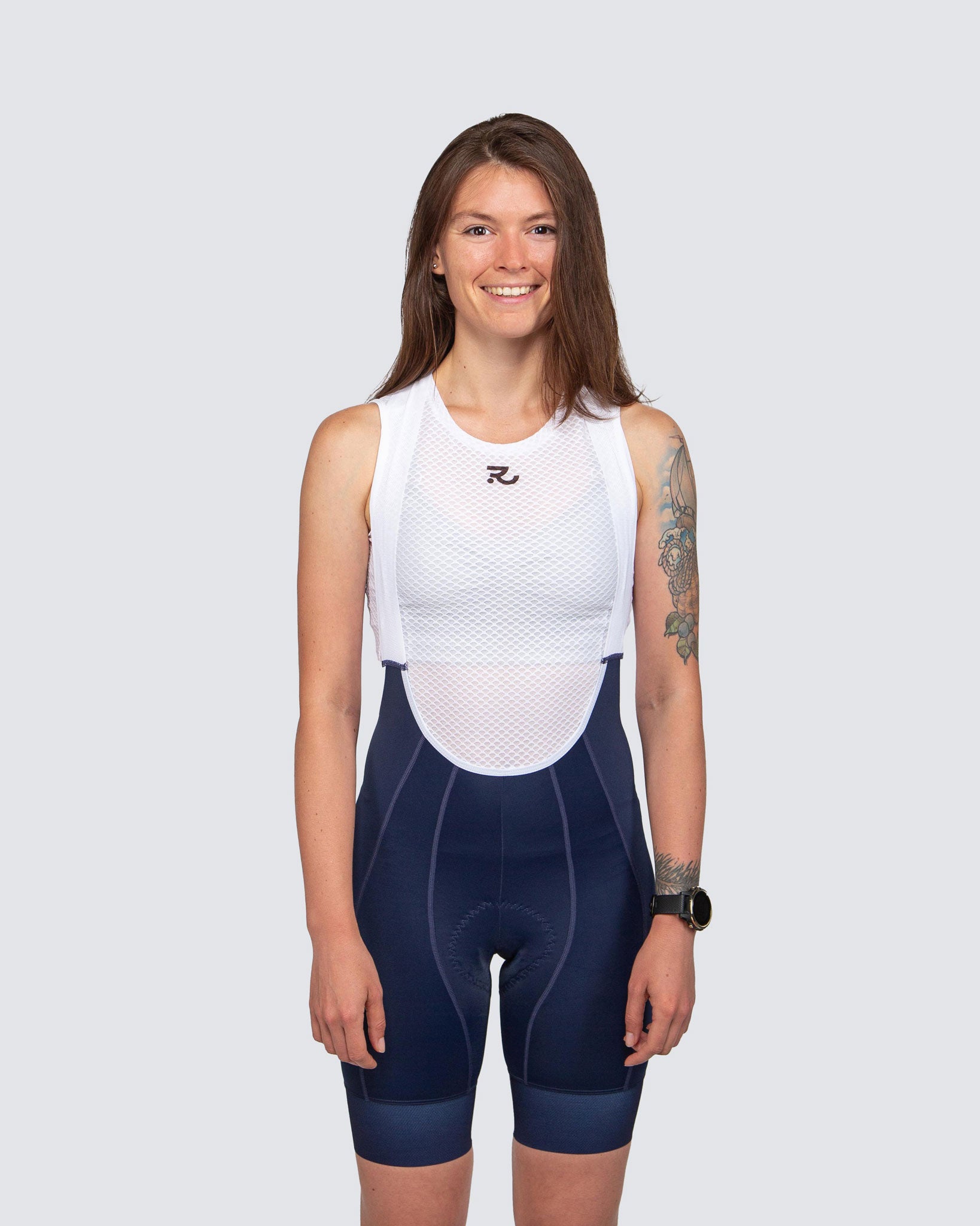 front view of blue cycling bibs with white base layer for women