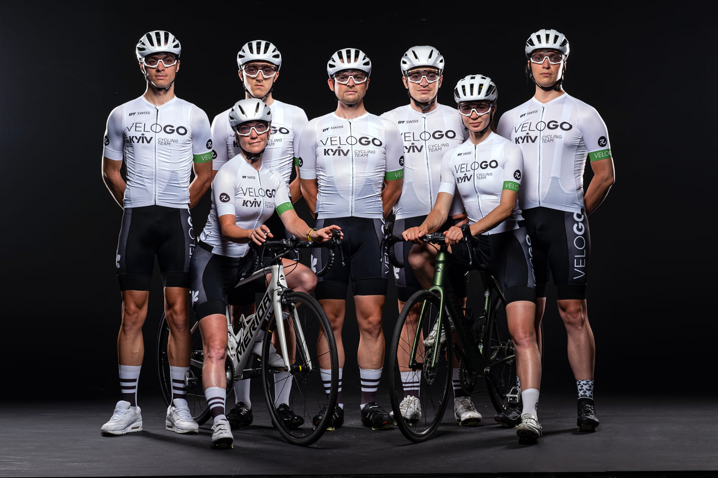 cycling team against black background