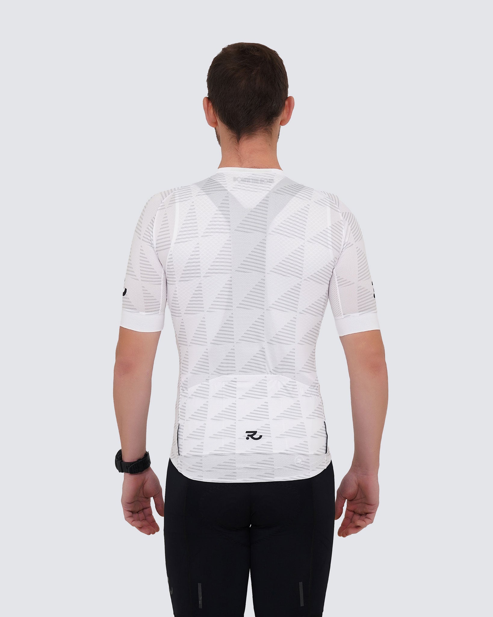 white cycling jersey from the back wore with black bib shorts