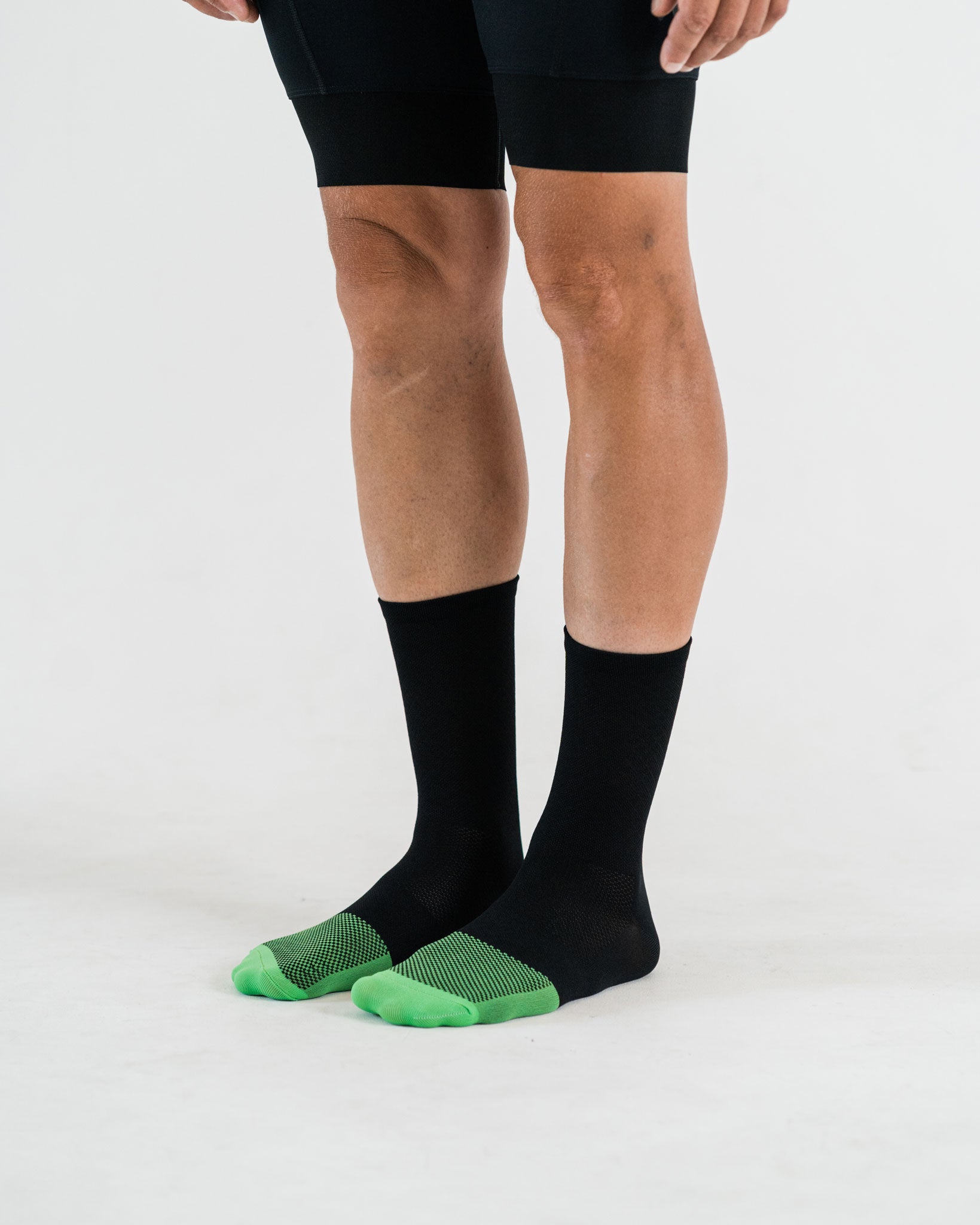 side view of black cycling socks