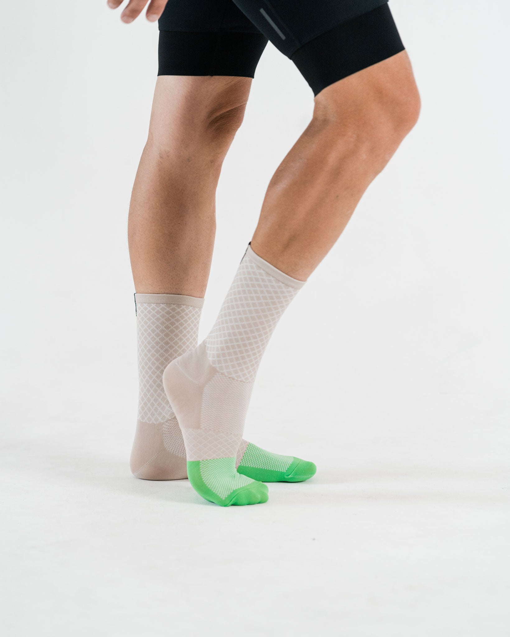 side view of beige cycling socks