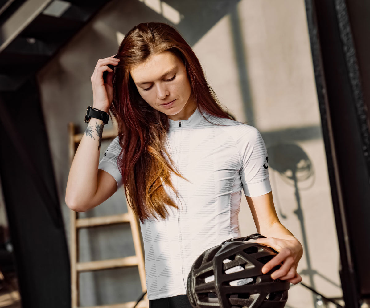 woman with a white cycling jersey