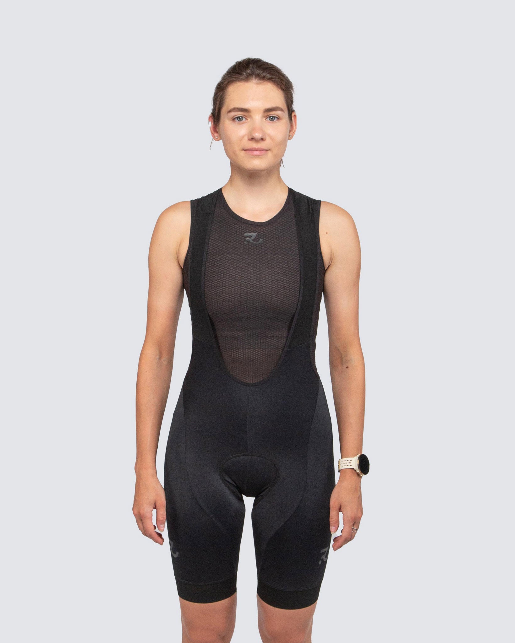 front view of black bib shorts for women